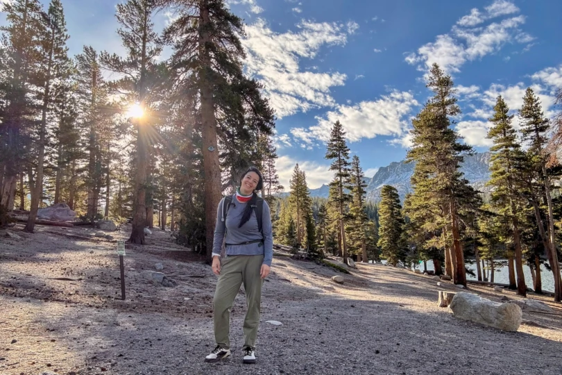 Hiker wearing Notace barefoot shoes on a forest trail