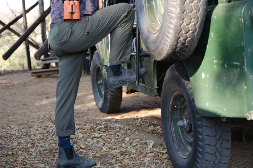 the author stepping onto a landrover in the new roark layover pro traveler pants