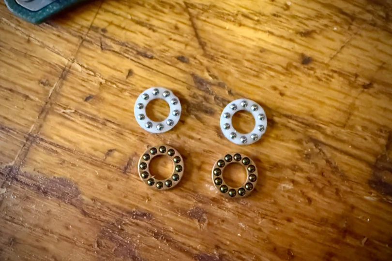Ball-bearing washers for the Flytanium knife laid out on a table