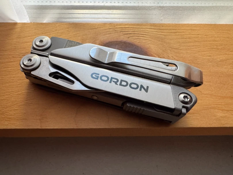 the harbor freight gordon 20-in-1 multitool on a wooden windowsill
