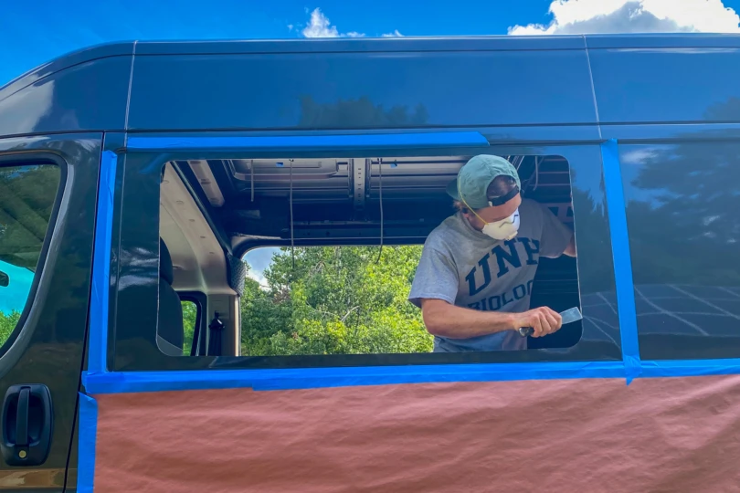 Window hole cut into the side of a campervan