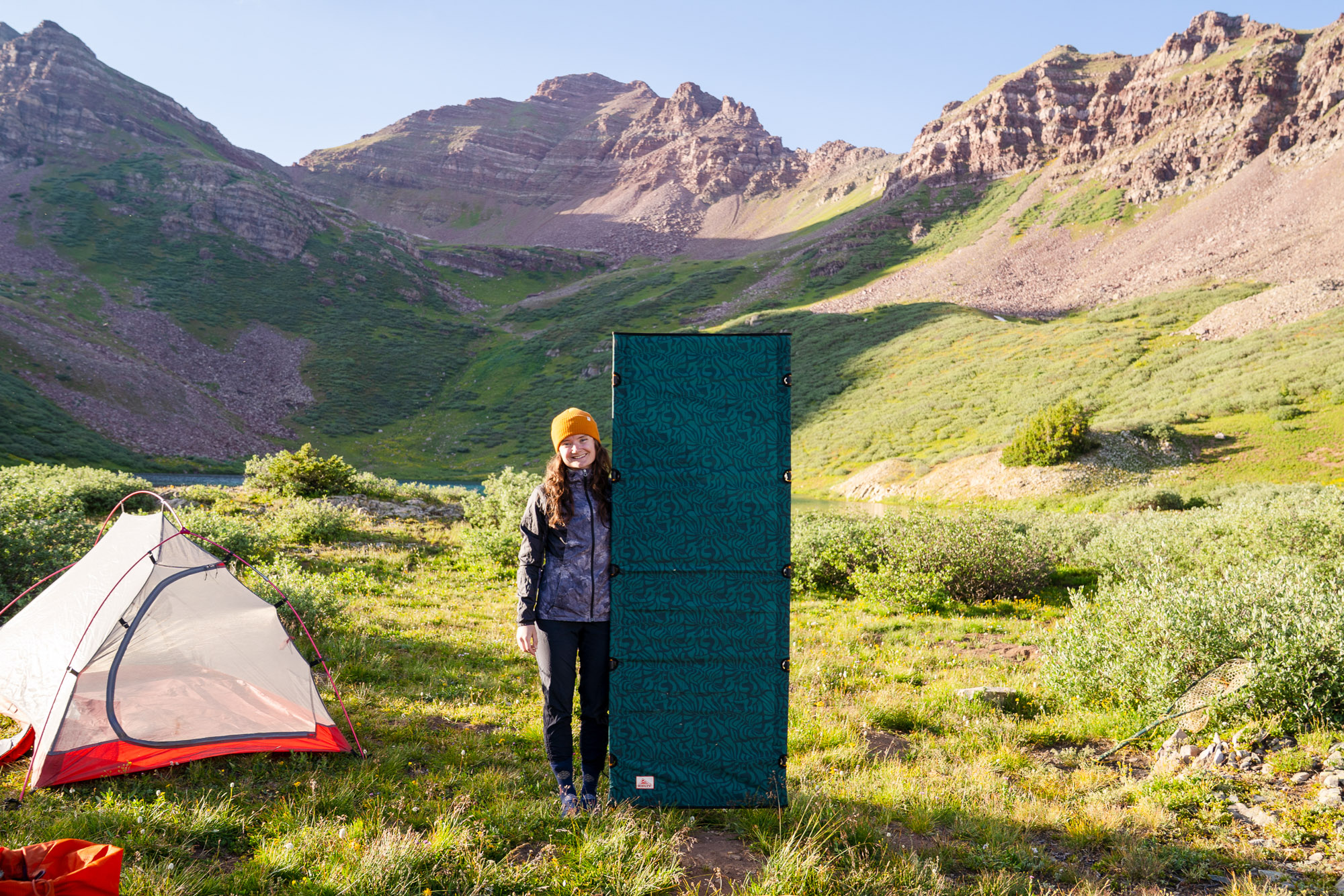 the 5'3" author standing beside the upright lowdown cot, showing the height restriction