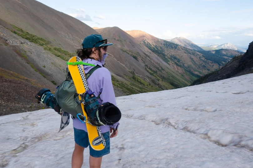 the author wearing the flash 18 daypack with mini skis and boots attached to it in colorado