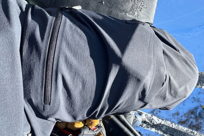 Close-up of the Norrona Lofoten Flex1 pants showing the fabric and side zipper detail