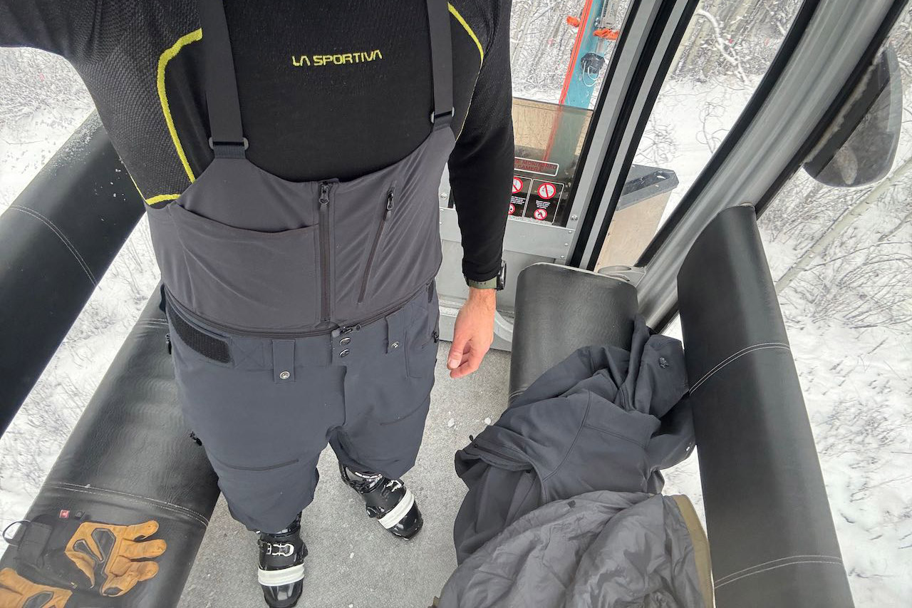 Close view of the Norrona Lofoten Flex1 pants with suspenders inside a gondola