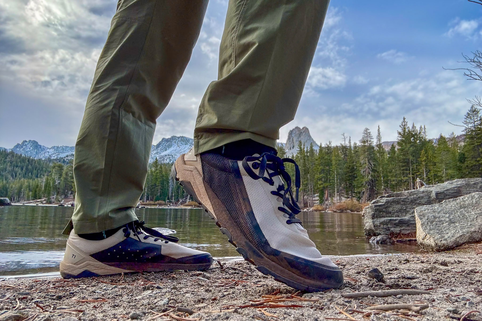 Women’s Barefoot Shoe stepping along a rocky lakeshore