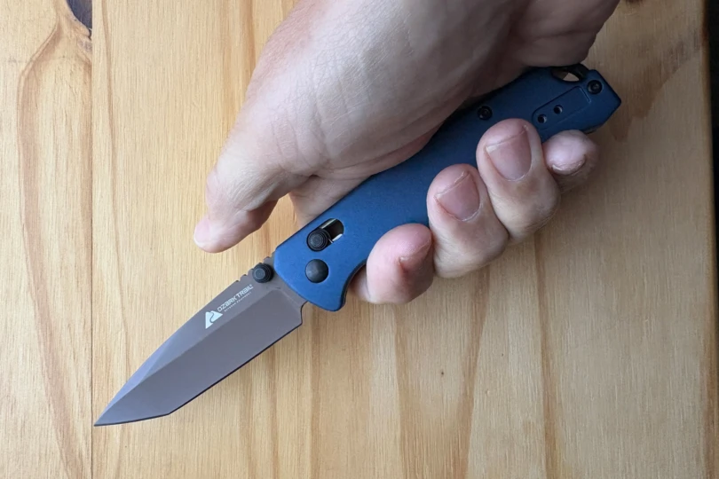 The Ozark Trail tanto blade held in hand to show grip and size
