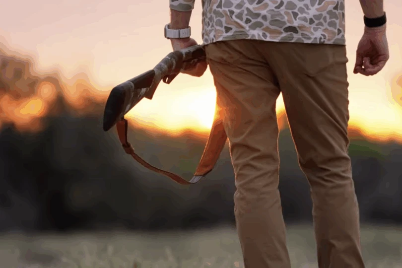 Hunter holding shotgun 