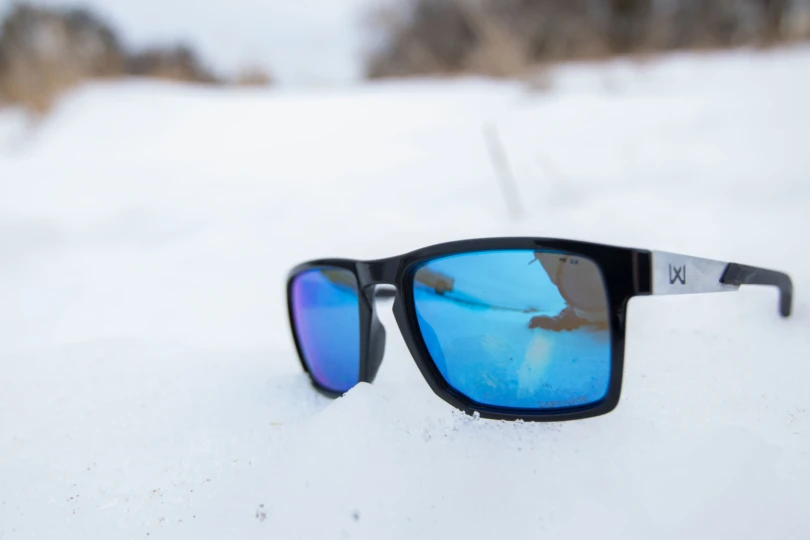 The Wiley X Apex sunglasses sitting on top of snow.