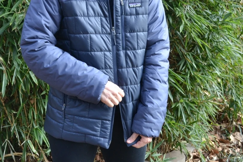 Close up shot of two-way zipper on blue down jacket