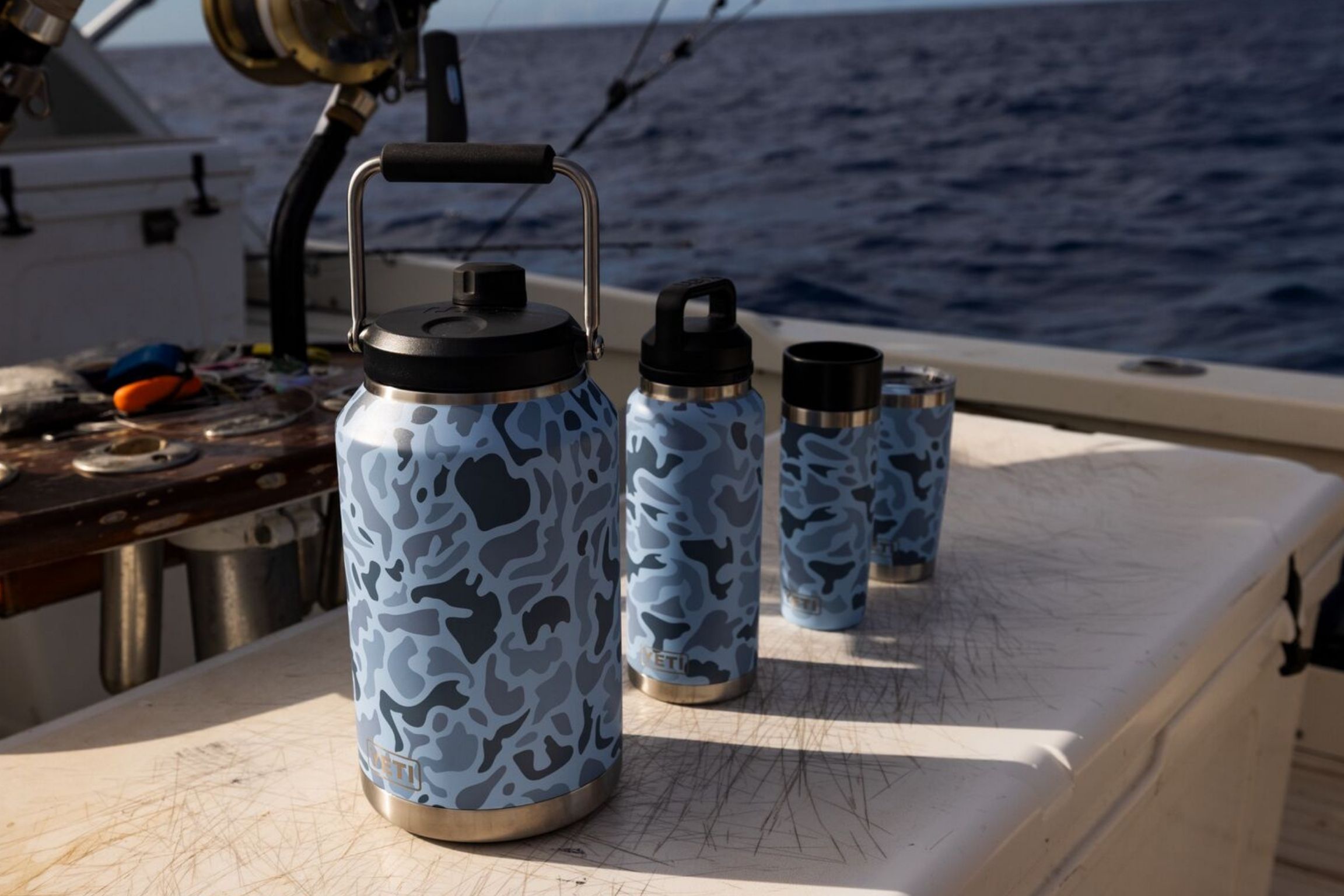 series of blue camo water bottles on boat