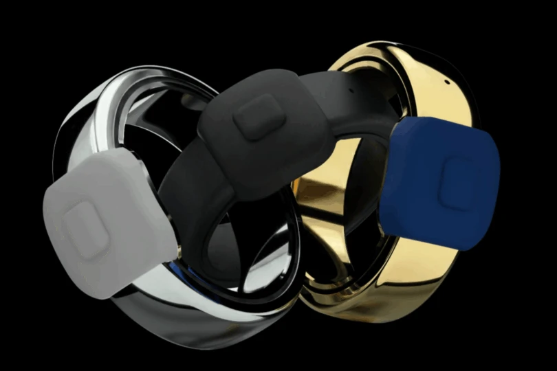 three rings with silver, black, and gold finishes