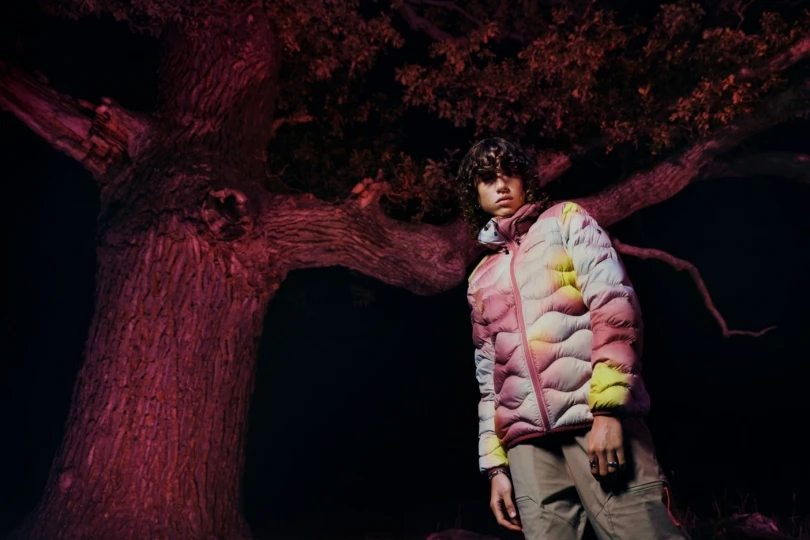 pink background person in pink down jacket