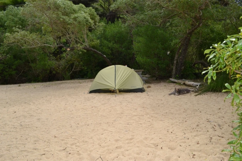 tent set up on tan campsite