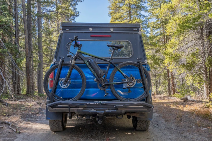 The rack carries a single bike securely on a forest road