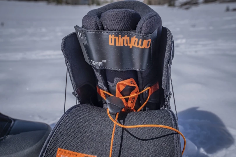 Close-up of a ThirtyTwo snowboard boot, showing internal lacing and padding.