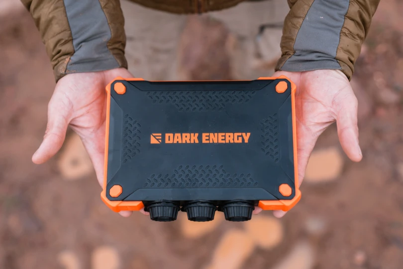 Hands holding the heavy-duty outdoor power pack