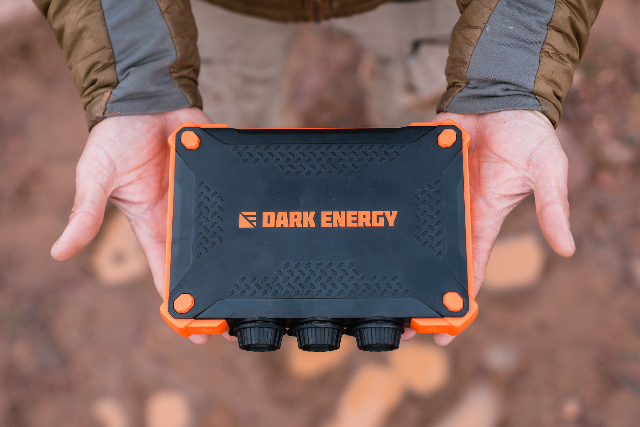 Hands holding the heavy-duty outdoor power pack
