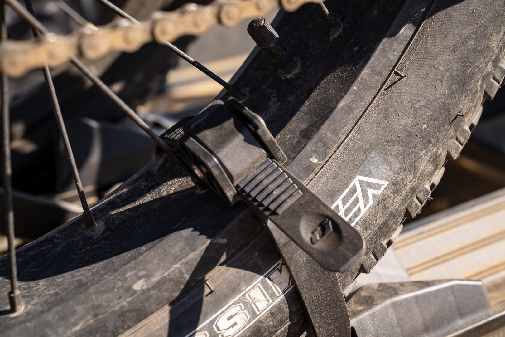 A close view of the wheel strap securing the tire in place