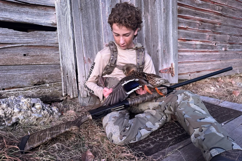 Youth Hunter with Shotgun and Duck