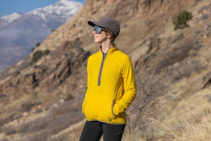 Backcountry Highliner PrimaLoft Air-Perm Fleece worn by a person standing in a rocky mountain area