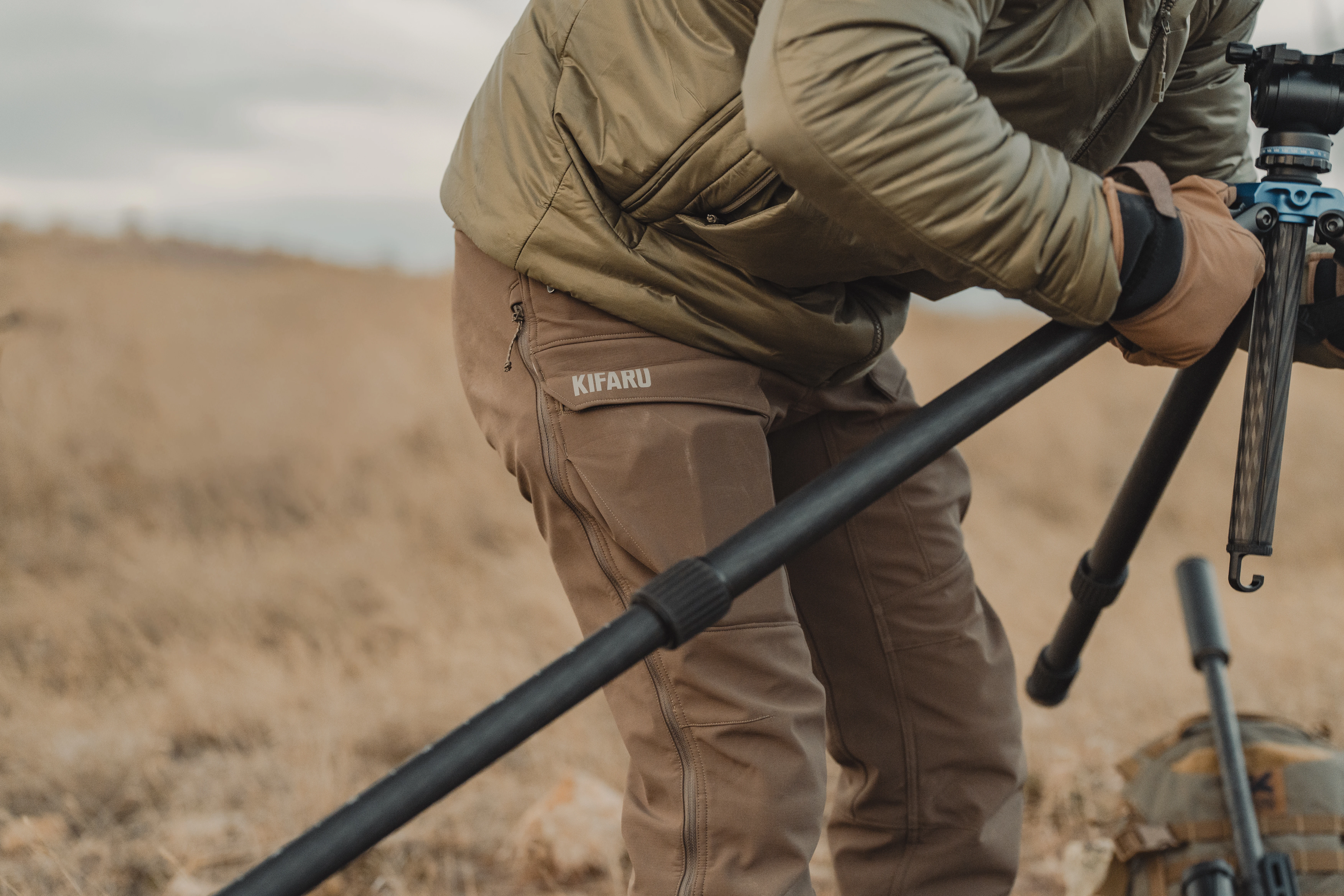 The new Kifaru Torlander pants on a hunter as he takes down a tripod.