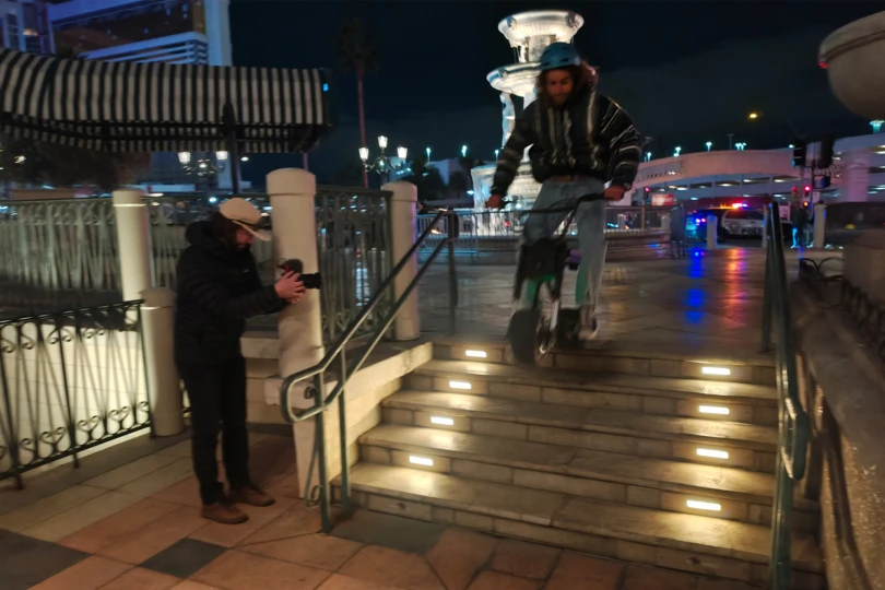 The Future Motion Antic eBike moves down a short set of stairs while being filmed at night