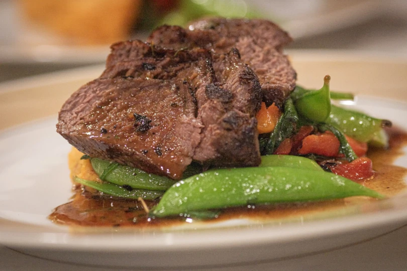 A closeup of a deer backstrap dish.