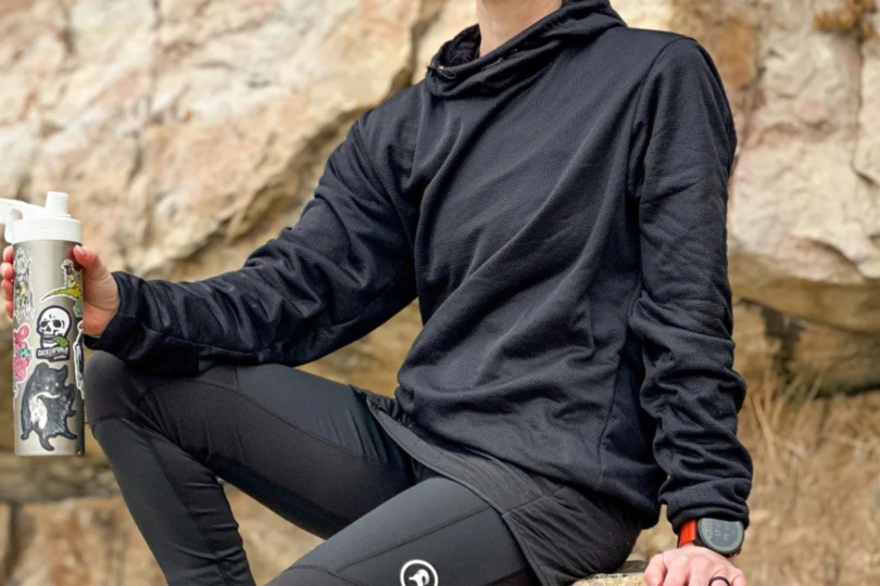 Woman sports ultralight fleece hoody.