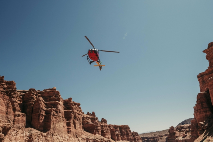 helicopter in desert canyon