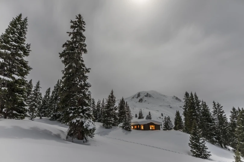 hut in snowy mountains