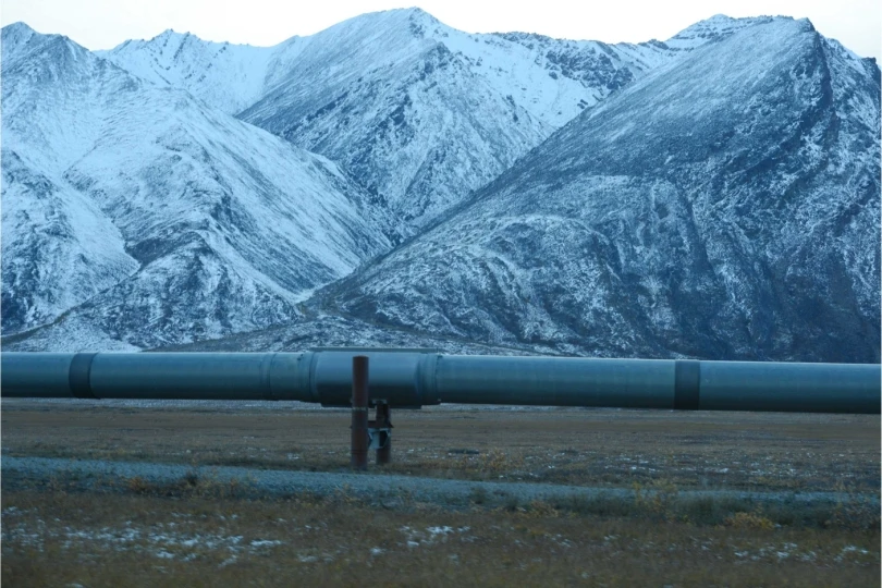 oil pipeline with mountains in background