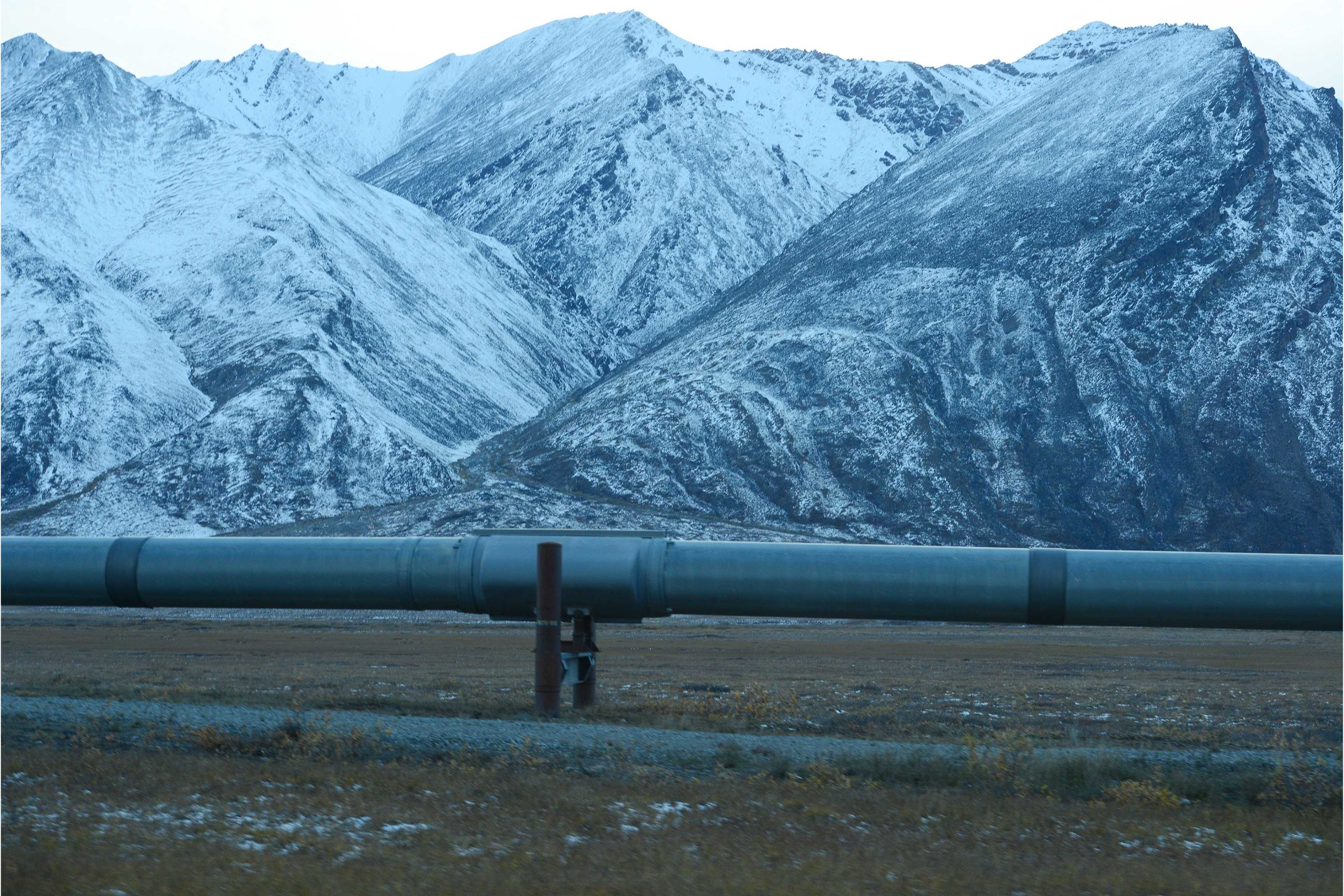 oil pipeline with mountains in background