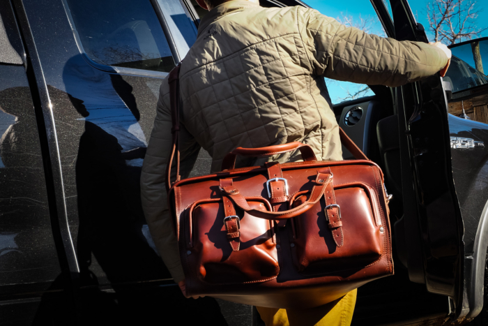 Saddleback Leather Company deep pocket duffle and man getting in truck