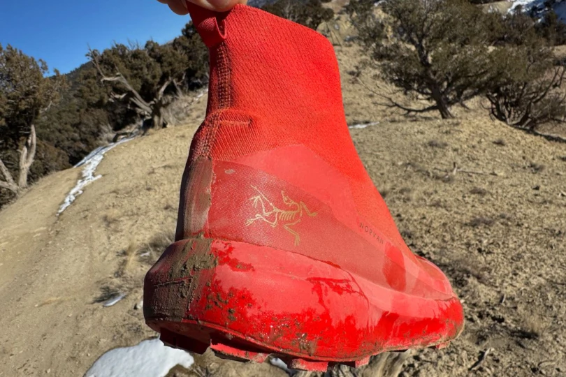 Mud-covered outsole of Arc’teryx Norvan Nivalis GTX shoes