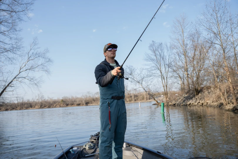 A fisherman casting.