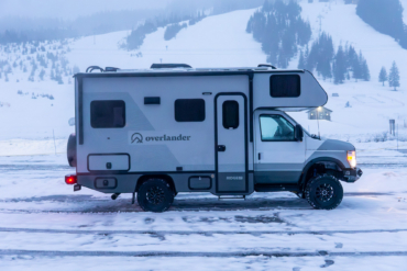 the ridge xt truck parked in a snowy ski area parking lot