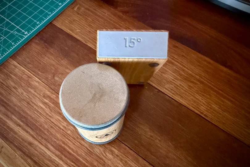 The HORL 3 Rolling Sharpener angle block sets a consistent sharpening angle on a wooden surface