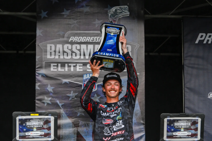 Fisher Anaya hoists the trophy at the Bassmaster Elite Series at Lake Martin.