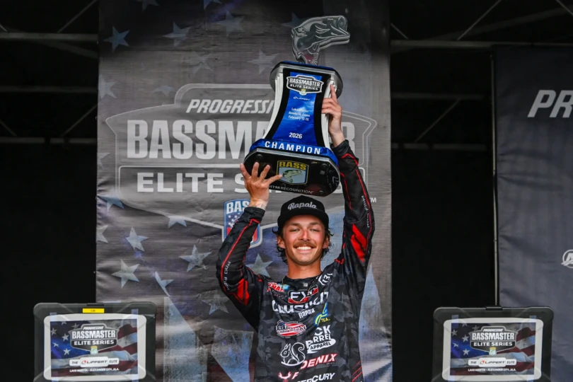 Fisher Anaya hoists the trophy at the Bassmaster Elite Series at Lake Martin.