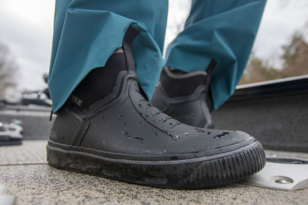 A closeup shot of the Strike Bigeye Boot on a boat deck