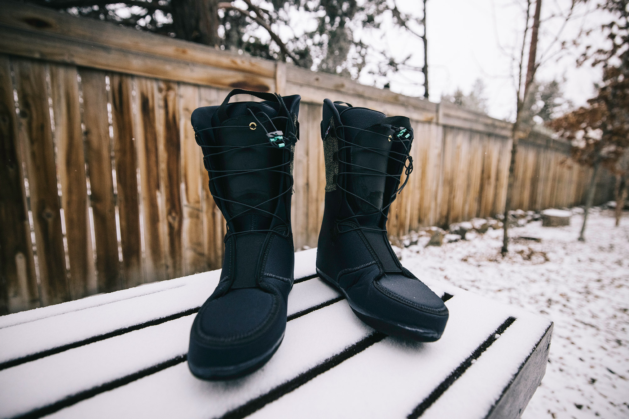 Front view of two ski boot liners placed side by side in the snow