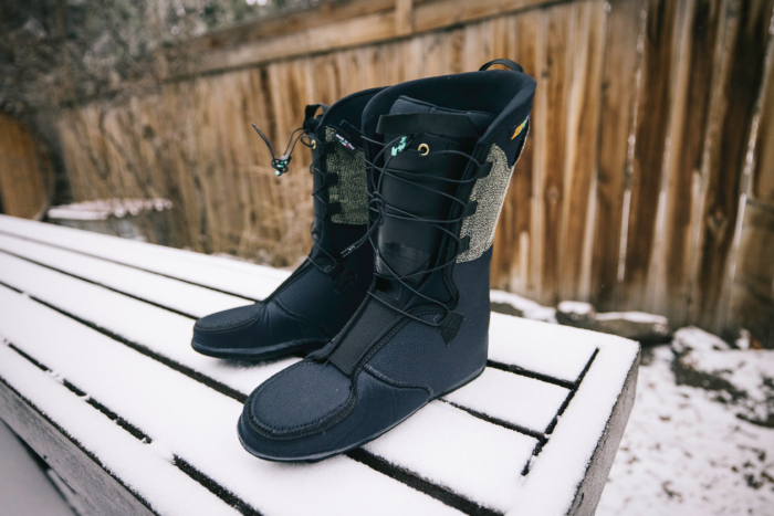 A pair of ZipFit liners standing upright on a snow-covered bench