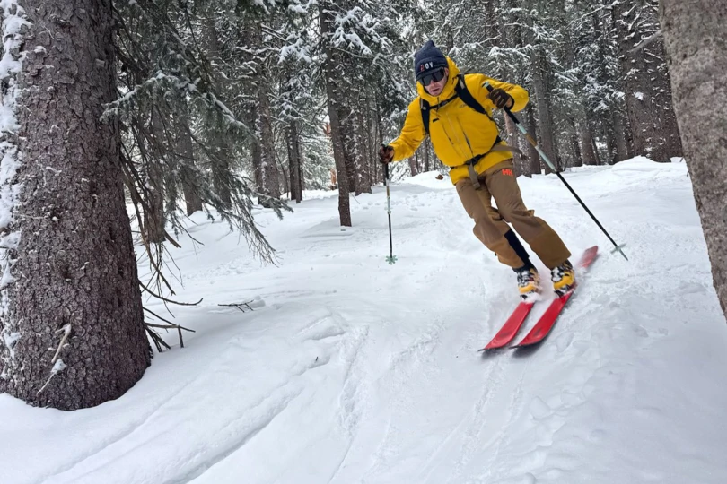 La Sportiva Sender ski boots worn while skiing through open glades on wider skis