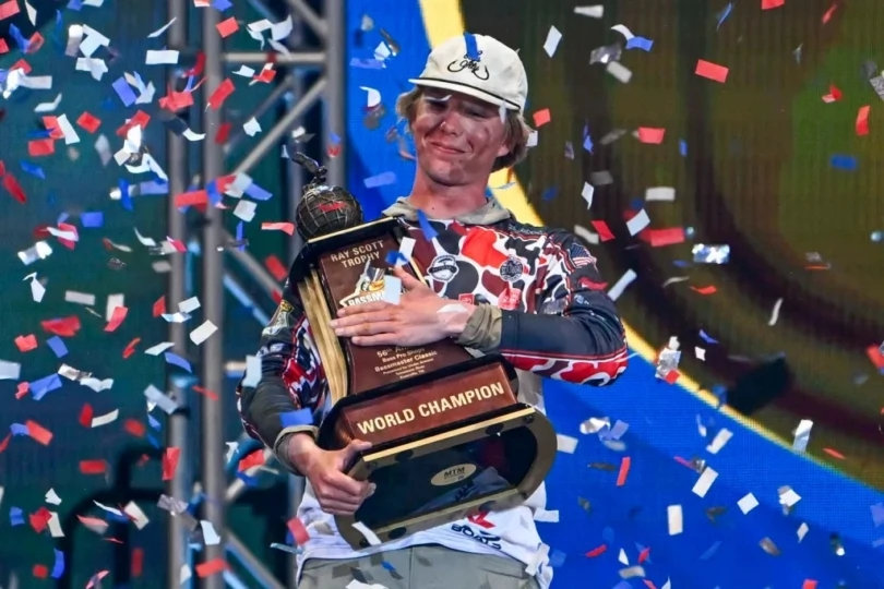 Dylan Nutt holding the Bassmaster Classic trophy.