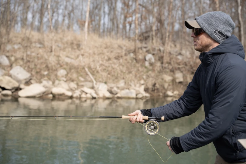 An angler stripping in fly line.
