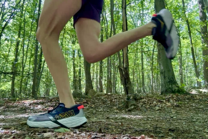Woman running weartng the Hoka Speedgoat 7 Trail Running Shoes