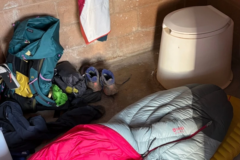 sleeping bag set up in trail bathroom