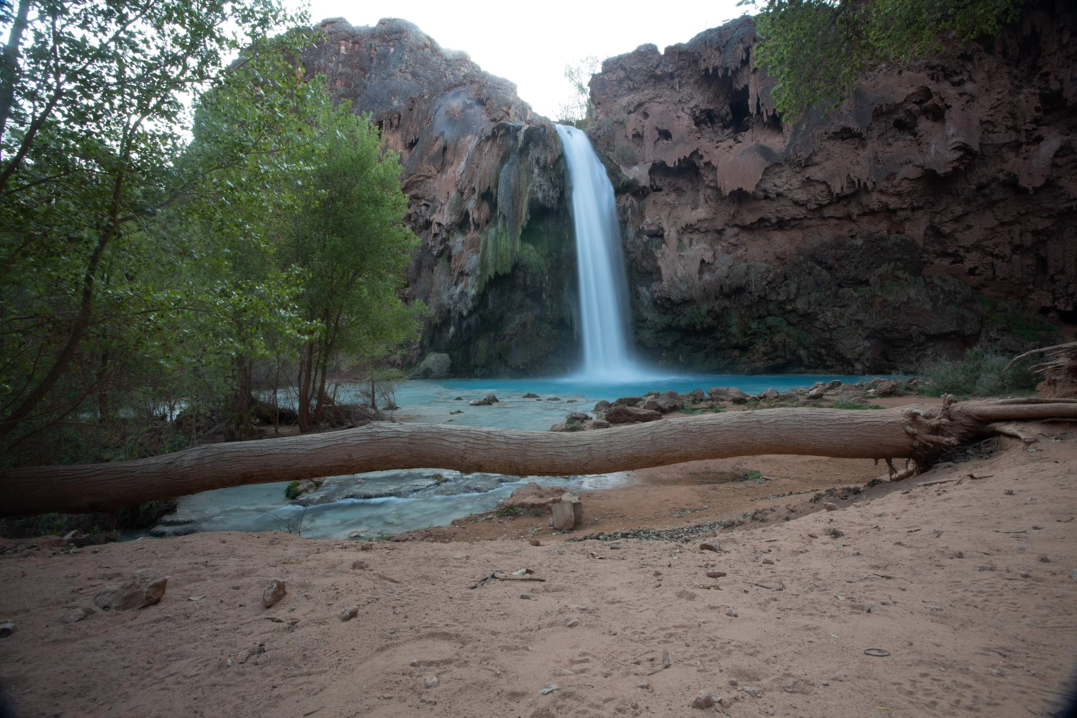 blue water fall on a beach