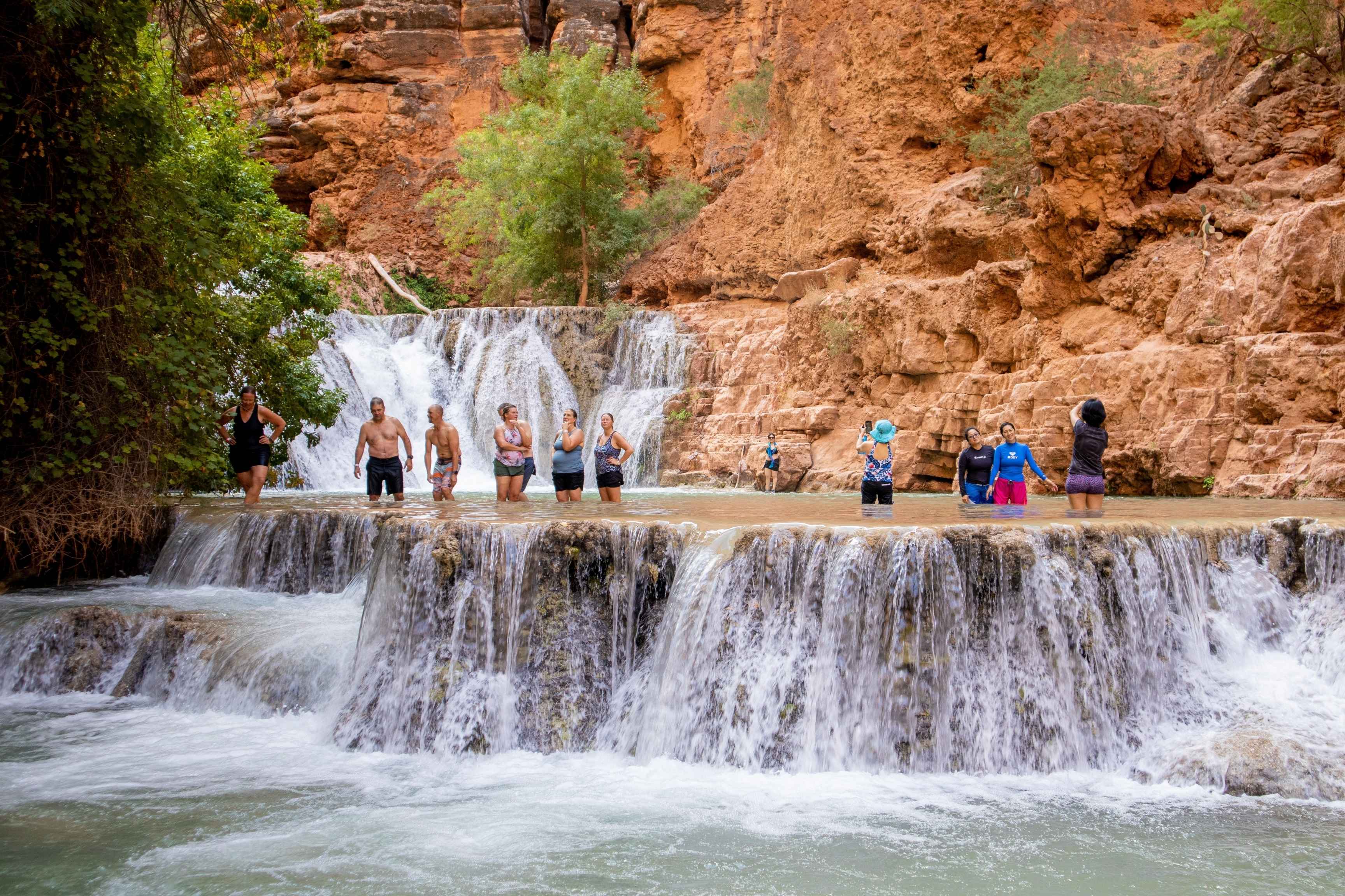 people swim and wide in series of pools